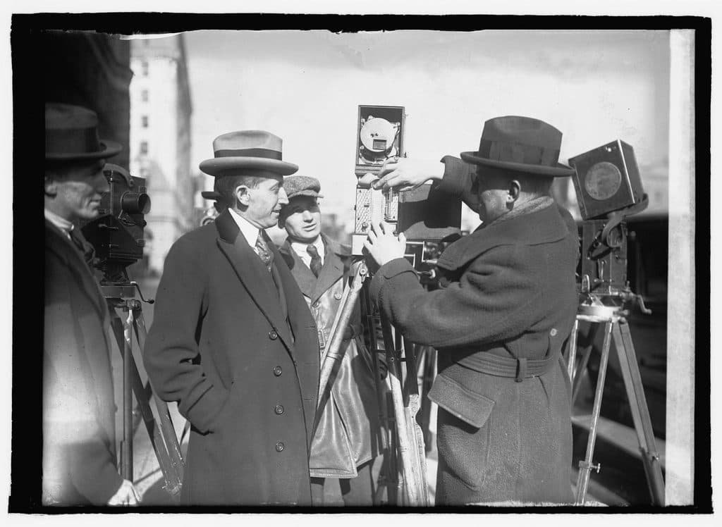 Old photograph of camera operators with cameras on tripods