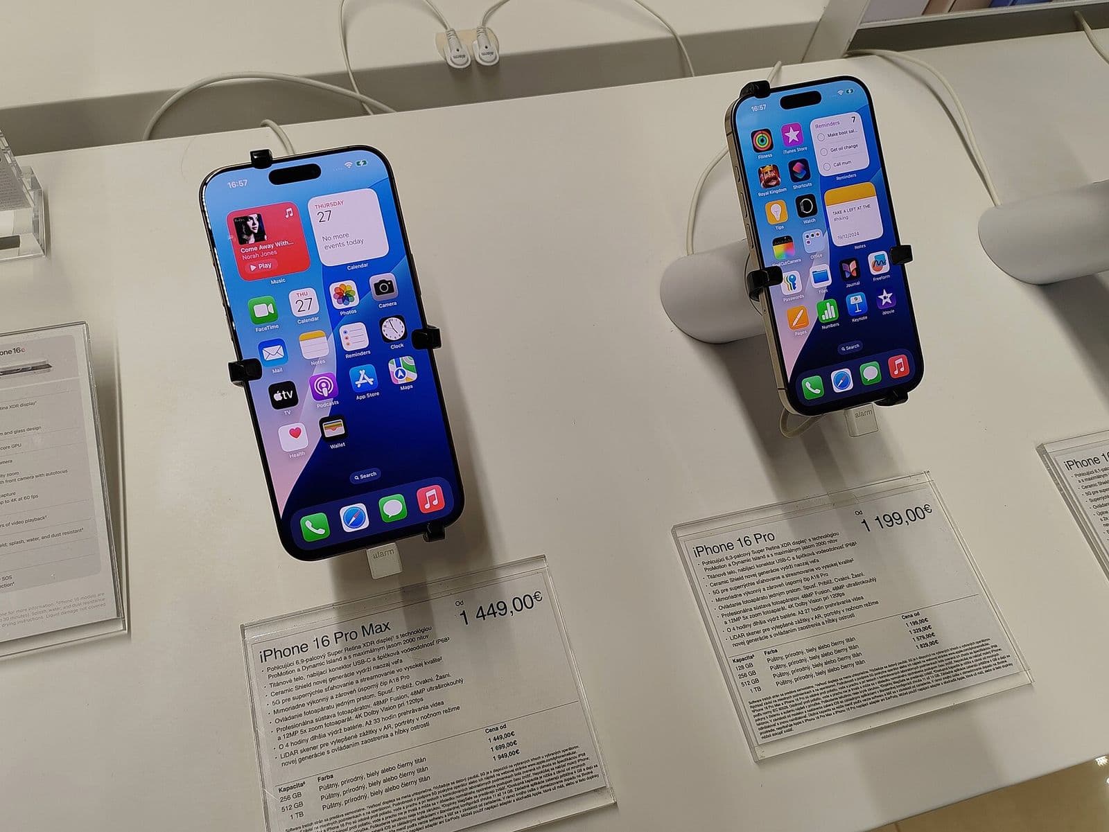 Two iPhone 16 Pro phones seen from the back in different colors, photographed in 2025